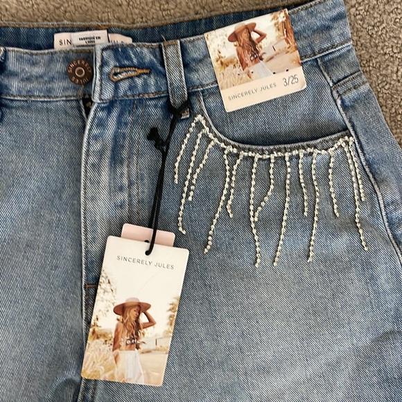 Denim cut off shorts with rhinestone fringe on pockets. Size 3/25 - Picture 2 of 4